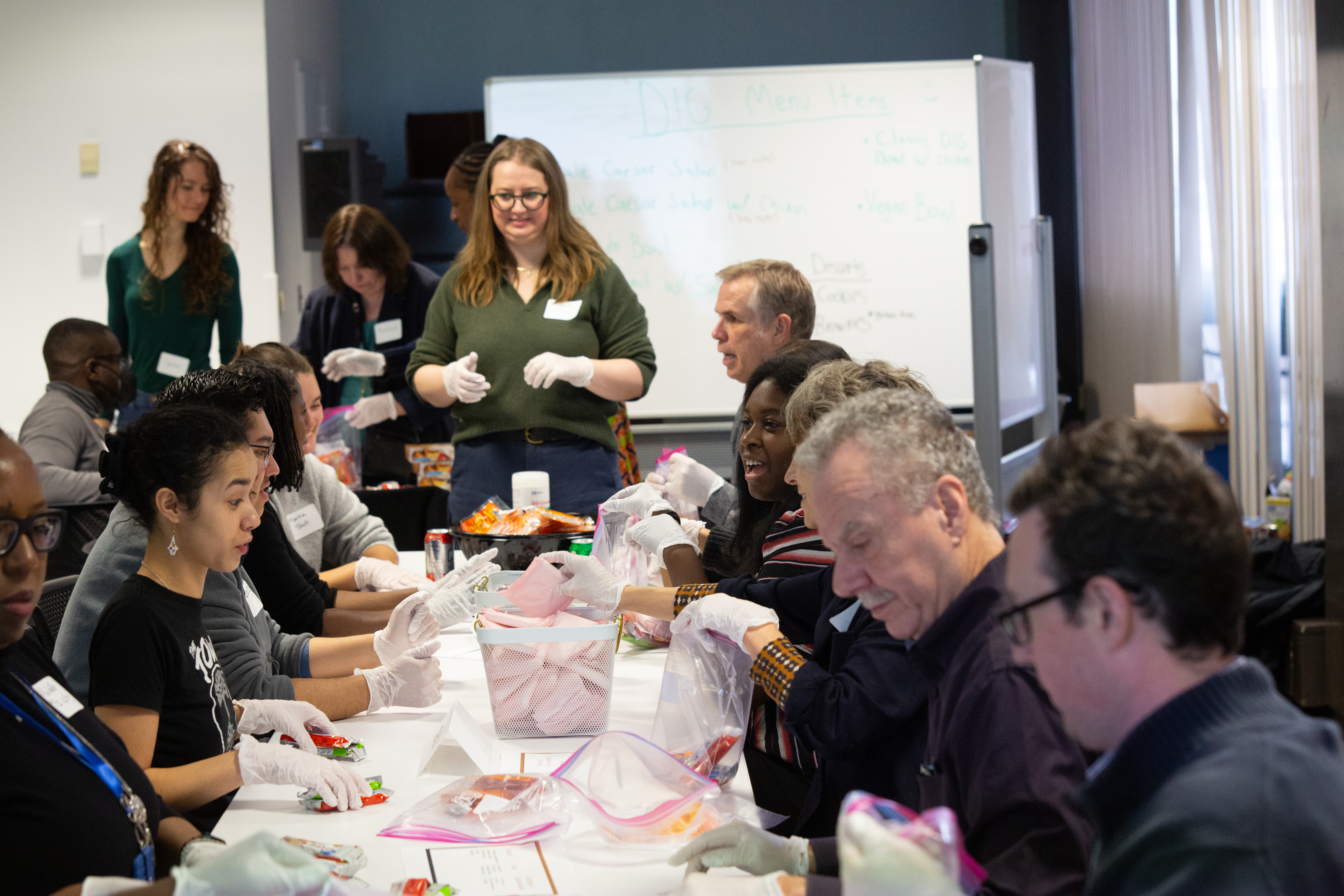 Columbia faculty and staff assembling care packages together